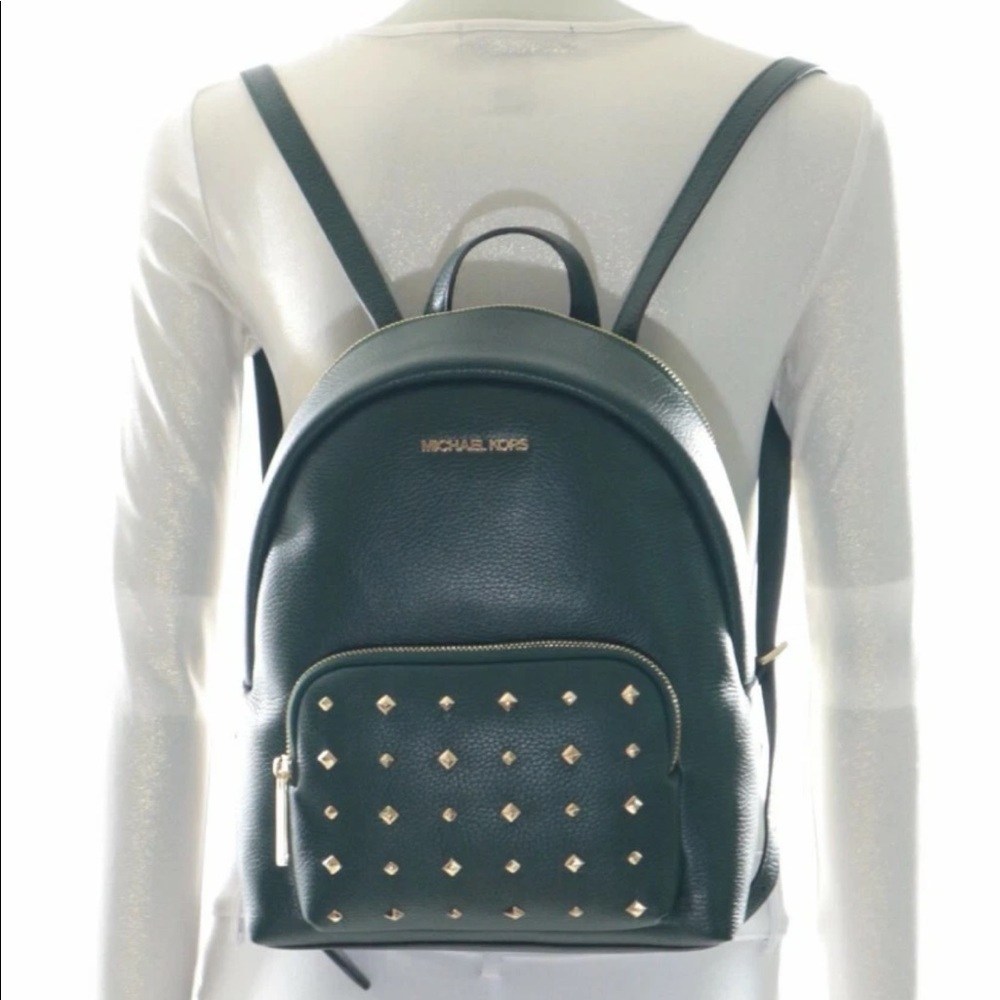 Michael Kors gold studded “Erin” green backpack.
